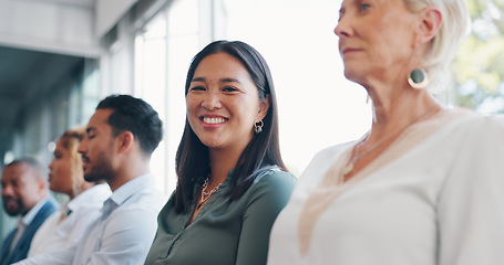 Image showing Face, coaching and seminar with a business asian woman sitting in a conference for learning or development. Team, meeting and strategy with a female employee and colleague group in the office