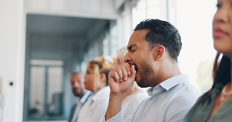 Image showing Tired, yawn and sleepless with a business man sitting in a meeting or presentation with his team for development. Yawning, exhausted and bored with a male employee suffering from insomnia at work