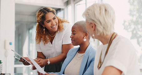 Image showing Tablet, documents and teamwork of business women discussing sales, advertising or marketing data. Paperwork, tech and group of business people with touchscreen planning strategy in office workplace.