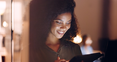 Image showing Office, night and happy black woman on a phone at her job in the dark smiling about funny text. Business, technology and social media mobile app scroll of a person working late on a work break