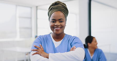 Image showing Face, black woman arms crossed and doctor with smile, consultant and in hospital. Leader, African American female and medical professional with happiness, ready for surgery, procedure and healthcare.