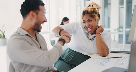 Image showing Laptop, success or happy employees fist bump in celebration of sales goals or target at office desk. Support, mission or woman celebrates partnership growth, team work or achievement with worker