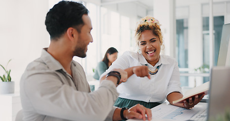 Image showing Laptop, success or happy employees fist bump in celebration of sales goals or target at office desk. Support, mission or woman celebrates partnership growth, team work or achievement with worker