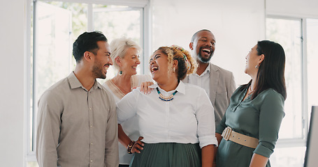 Image showing Success, happy or funny business people in an office building laughing at a funny joke after a group meeting. Diversity, comic or employees with big smiles bonding after a successful business deal