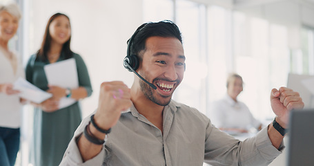 Image showing Applause, success and man celebrate at call center for target, bonus and sale with employees for congratulations on win. Contact us, CRM and telemarketing customer support men and women at computer