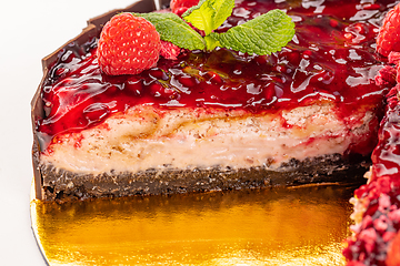 Image showing Cheesecake with pomegranate sauce