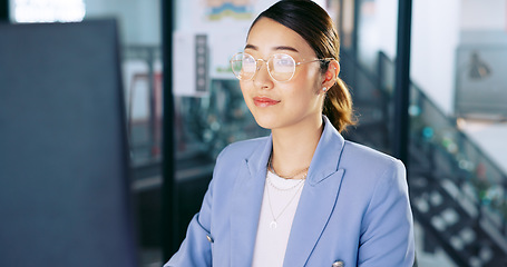 Image showing Computer, office and Asian business woman with glasses typing and planning a corporate project. Success, professional and professional employee working on a company report, document or proposal on pc