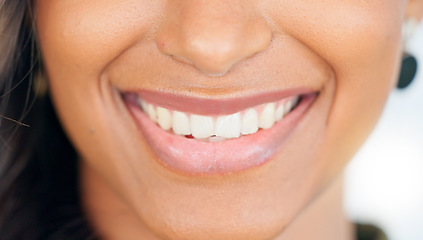 Image showing Smiling, beautiful and fresh female face winking feeling fun, silly and playful. Portrait of a happy woman head with perfect skin and healthy teeth. Closeup of a carefree natural beauty with a smile