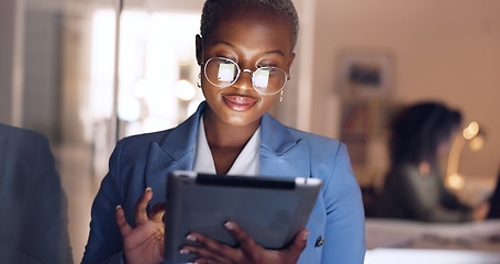 Image showing Black woman, tablet and business in office at night working overtime, corporate deadline or online research. Social media, internet surfing and female from Nigeria on digital tech in dark office.