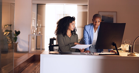 Image showing Business women, planning and night discussion of documents, paperwork and data report for kpi research, strategy analytics and economy analysis. Female employees computer collaboration in dark office