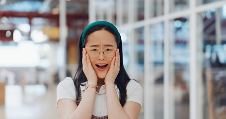 Image showing Wow, surprise and excited with a business asian woman looking shocked by putting her hands on her face in expression. Portrait, emoji or motivation with a female employee feeling shock frim good news