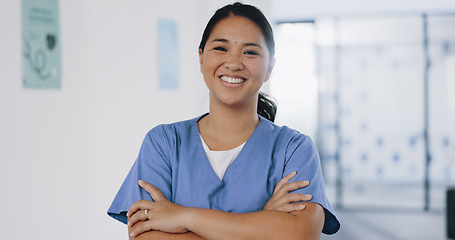 Image showing Nurse, face or arms crossed in hospital clinic with wellness motivation, medical research trust or surgery planning motivation. Portrait, smile or happy healthcare worker with confidence in Indonesia