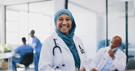 Image showing Face, Islamic woman and doctor with smile, hospital and confidence for surgery, consulting and smile. Muslim female, lady and medical professional for healthcare, consultant and surgeon in clinic.