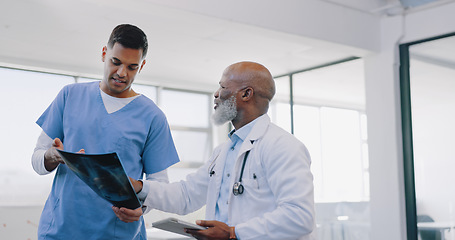 Image showing Doctor, nurse and xray with men and health consultation, advice and help with healthcare discussion and cardiology. Medical talk, hospital and team with collaboration and surgery with cardio surgeon.