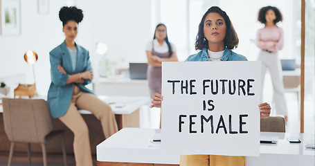 Image showing Equality, empowerment and female leader holding a sign in the office with her business woman group at work. Future, human rights and diversity with a feminism team working for revolution or change