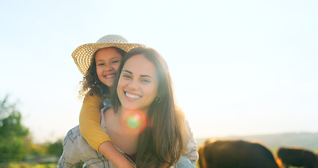 Image showing Mother, child on farm, hug and bonding in the countryside, together farming, mom piggy back kid with fun outdoor in nature. Happy, woman and girl, agriculture and field, sustainability and cattle.