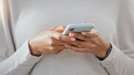 Image showing Person holding a phone while texting on social media. One trendy woman writing a quick and convenient text message on an instant chat app. Closeup of a girl browsing content online or on the internet