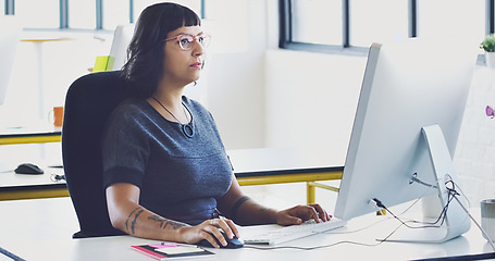 Image showing Business, woman and computer for typing, focus and digital planning for sales, advertising and modern office. Female employee thinking, administrator and manager with pc, online reading or web design