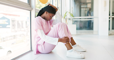 Image showing Stress, doctor and black woman on floor, headache and hospital with depression, burnout and anxiety. Healthcare, African American female or medical professional on ground, mental health or frustrated