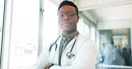 Image showing Black man, face or doctor arms crossed in hospital with surgery ideas, life insurance vision or medical wellness goals. Portrait, healthcare worker or thinking medicine employee in trust innovation