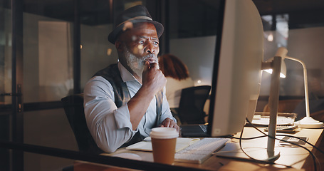 Image showing Businessman, focus and computer, typing and working overtime, journalist writing article for newspaper. Office, night and professional at desk, computer screen and technology with deadline.