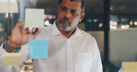 Image showing CEO, sticky note or senior manager writing a marketing strategy or brainstorming ideas for business growth. Businessman, boss or Indian entrepreneur with mission, goals or vision planning a project