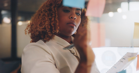 Image showing Corporate black woman, board and sticky note in planning, vision or marketing strategy at night. Woman, documents or glass for brainstorming, target or ideas for digital marketing, advertising or seo