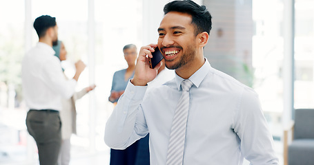 Image showing Businessman, communication and phone call with mobile networking at financial advisory startup company. Conversation, b2b and business man consulting on smartphone, talking and standing in office.