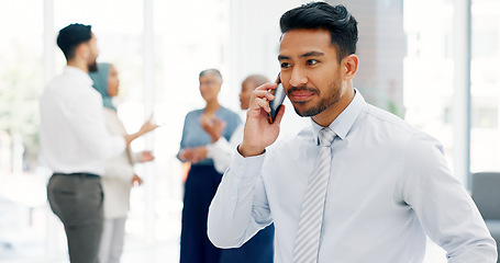 Image showing Businessman, communication and phone call with mobile networking at financial advisory startup company. Conversation, b2b and business man consulting on smartphone, talking and standing in office.