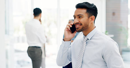 Image showing Businessman, communication and phone call with mobile networking at financial advisory startup company. Conversation, b2b and business man consulting on smartphone, talking and standing in office.