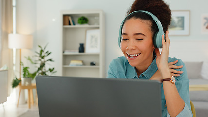 Image showing Video call, headphones and laptop of woman in home office working online, virtual communication and writing for website management career. Zoom call, technology and worker typing for a marketing job