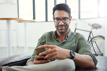 Image showing Creative businessman, phone and smile for social media, communication or advertising at office. Portrait of happy employee man smiling with smartphone in networking or online conversation for startup