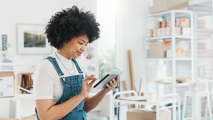 Image showing Black woman, online shopping and tablet at warehouse office scroll for free shipping order delivery shipment information. African girl worker, logistics and tech working for internet ecommerce shop