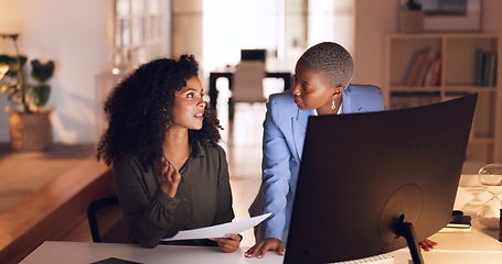 Image showing Documents, collaboration and talking with a business woman team working in their office at night. Teamwork, conversation and training with a female employee explaining a report to a colleague