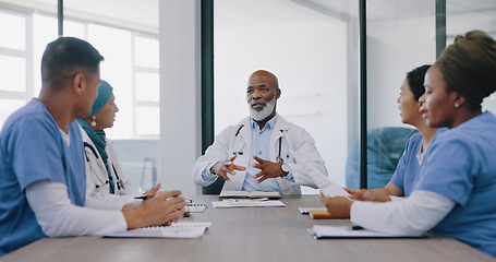 Image showing Mature doctors, nurses or teamwork meeting in hospital planning, medical surgery ideas or medicine treatment strategy. Talking healthcare workers, men or women with paper documents in collaboration