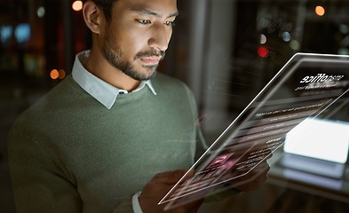 Image showing Business man, tablet and hologram in office for social media, web browsing or music at night. Futuristic, 3d and male with digital ui, ai or ux app or software for streaming album in dark workplace.