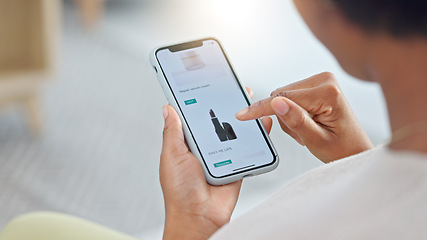 Image showing Shopping online and scrolling through makeup products to find a sale or discount. Hands of a woman browsing cosmetics on her phone from above. Enjoying the convenience and ease of purchasing apps