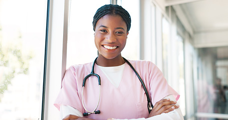 Image showing Portrait, healthcare and hospital with a nurse black woman arms crossed in a hallway with a stethoscope. Medical, insurance and service with a female medicine professional standing in a clinic