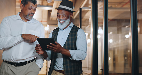 Image showing Partnership, tablet and businessmen walking in the office analyzing, talking and planning a project. Technology, professional and senior male employees working on a mobile device in the workplace.