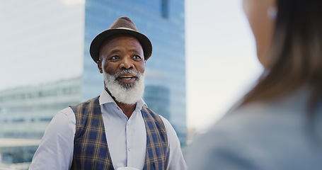 Image showing City, black man and woman on rooftop networking, talking or speaking of goals, project development or vision. Team building, relaxing or senior businessman in conversation, communication or chatting