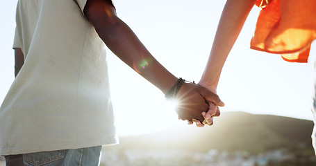 Image showing Interracial couple, bonding or holding hands in support, trust or security in Lisbon city, Portugal. Zoom, black man or woman in solidarity, love or unity on summer holiday vacation in relax location