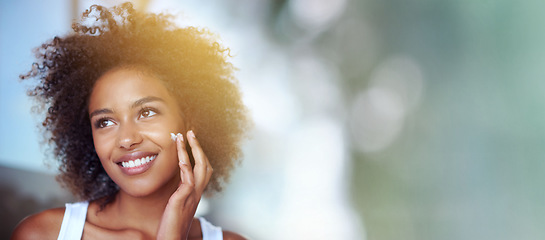 Image showing Skincare, beauty cream and face of black woman with mockup for wellness, facial treatment and cosmetics. Dermatology, healthy skin and happy girl with spf creme, lotion and moisturizer in bathroom