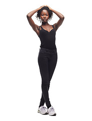 Image showing Fashion, beauty and portrait of a black woman in a studio with a casual outfit, confidence and natural pose. Beauty, young and African female model with afro posing while isolated by white background