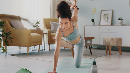 Image showing Yoga, tablet and woman with online video for stretching exercise in the living room of her house. Girl with balance during fitness workout on the internet with tech in the lounge of her home