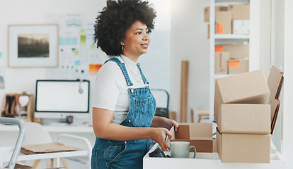 Image showing Startup, delivery and shipping in boxes for online shopping business. Businesswoman packing products from online business in a box to ship to clients and buyers. Black woman working in the office