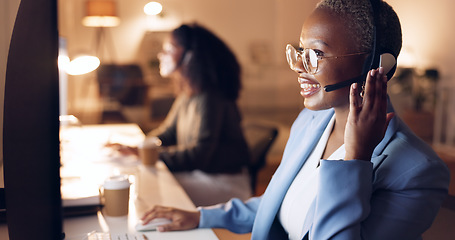 Image showing Call center, customer service and night shift black woman telemarketing consultant wearing headset at computer. Sales female in contact us and crm support talking during call working late with smile