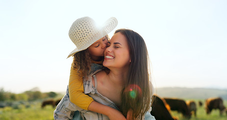 Image showing Mother, child on farm, hug and bonding in the countryside, together farming, mom piggy back kid with fun outdoor in nature. Happy, woman and girl, agriculture and field, sustainability and cattle.