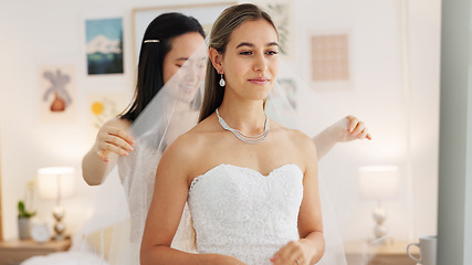 Image showing Bride, wedding and woman helping with veil in dressing room smile for special day. Happy women love and bridesmaid support or helping bride with fabric head piece for beauty, marriage and happiness