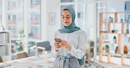 Image showing Phone, thinking and feedback with a business muslim woman typing a text message in her office at work. Contact, mobile and idea with an islamic female employee reading an email while working alone