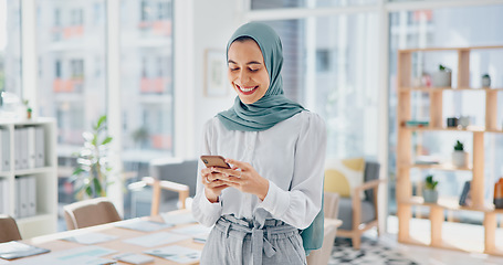 Image showing Creative muslim woman, phone and face smile for social media, communication or texting in startup at the office. Portrait of happy islamic woman smiling for online conversation on mobile smartphone